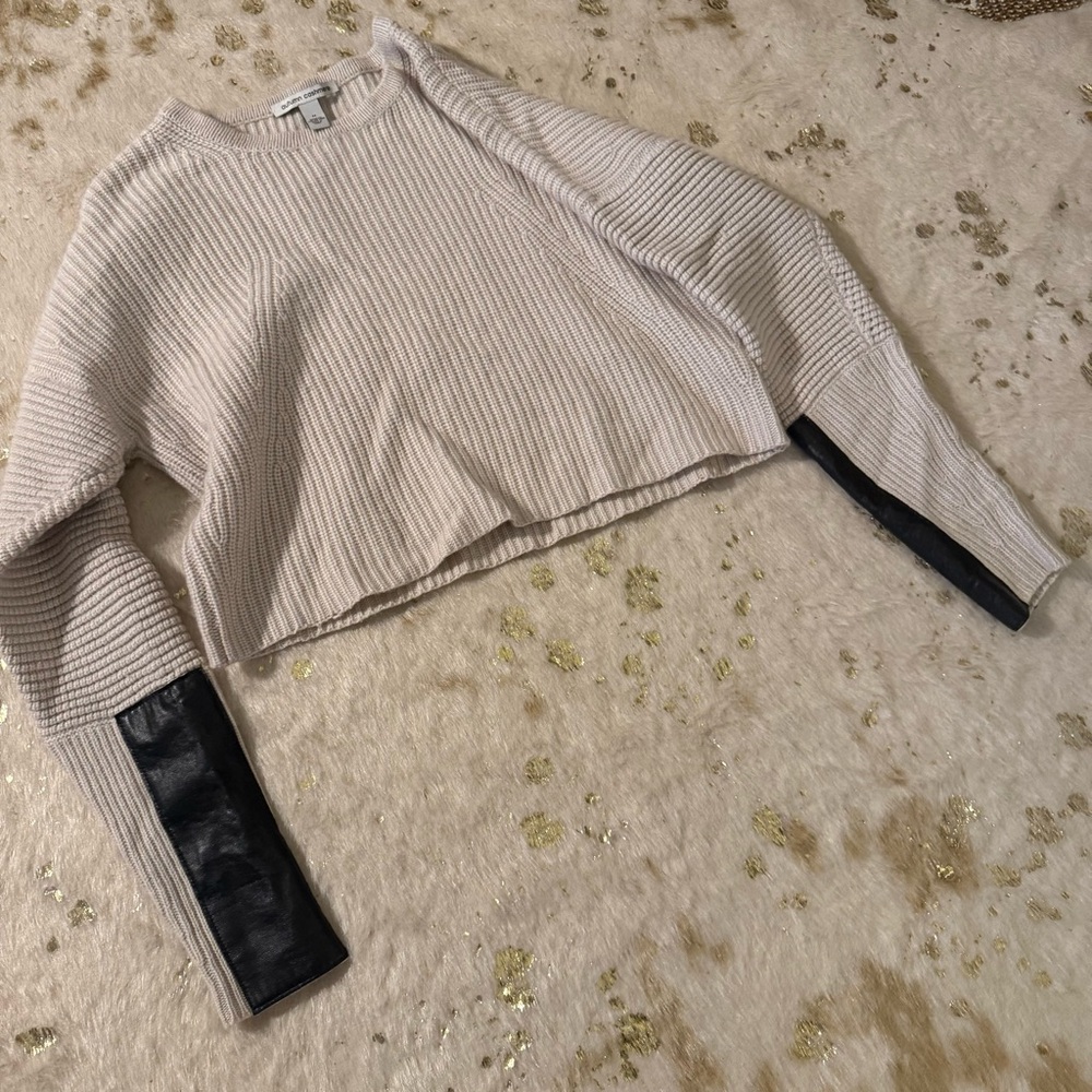 Autumn Cashmere beige cropped crew neck sweater black sheepskin patches
medium